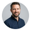 Smiling bearded man in a navy shirt, Avenix expert